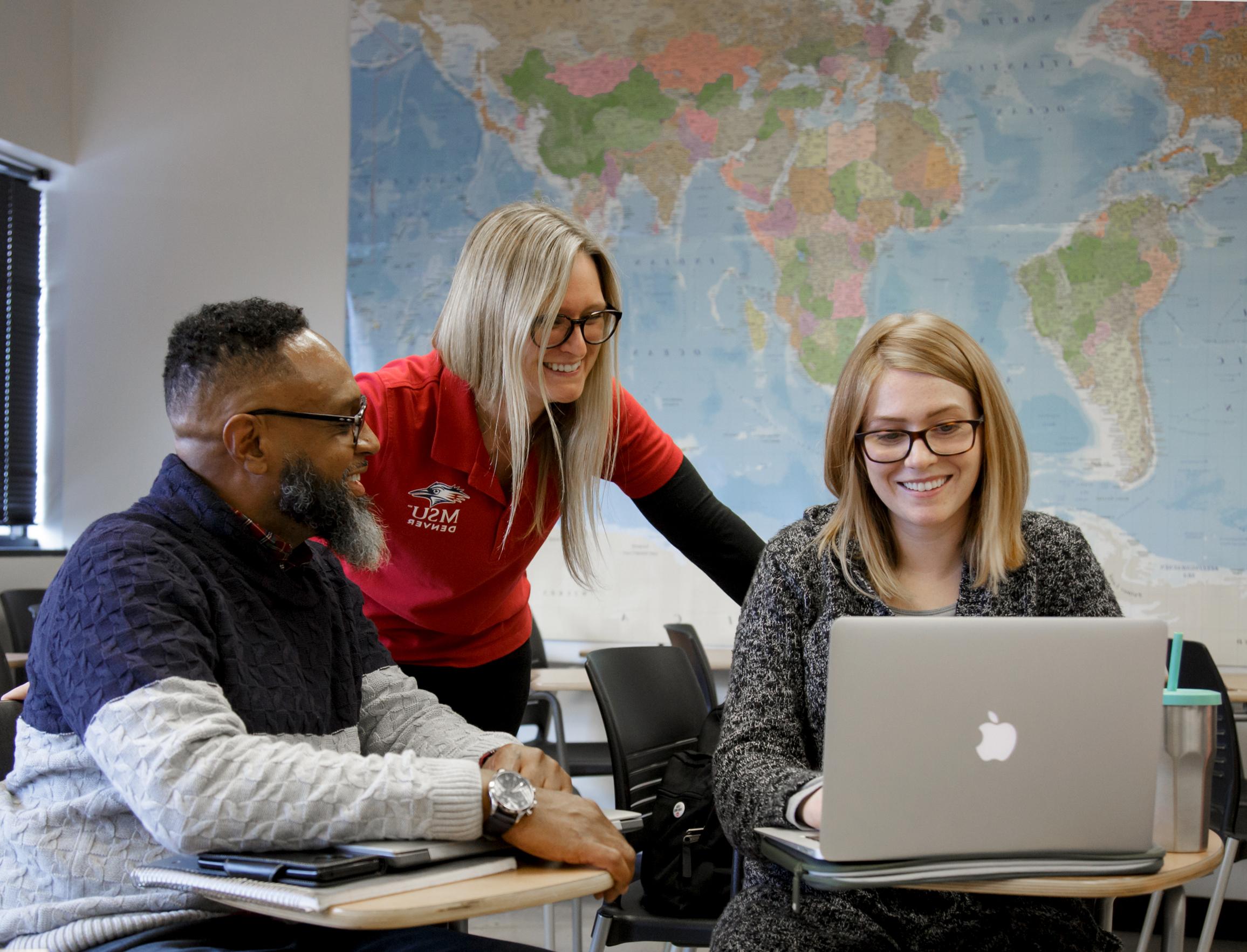 Photo of professor with students in classroom